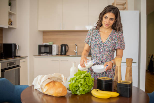 istock Young woman is preparing a meal 1501975782