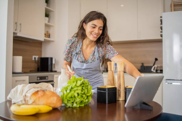 istock Young woman is preparing a meal 1501975787