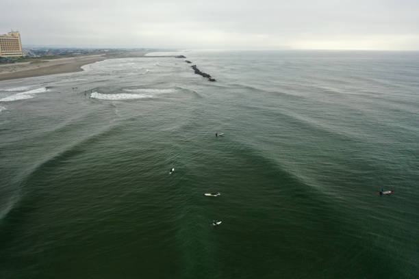 istock surfer filmed by drone 1501980623