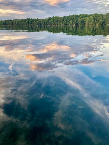 istock Cloudy reflections on a glass-like lake. 1501984172
