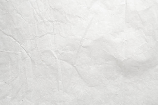 istock Abstract white crumpled and creased recycle paper texture background 1501984186