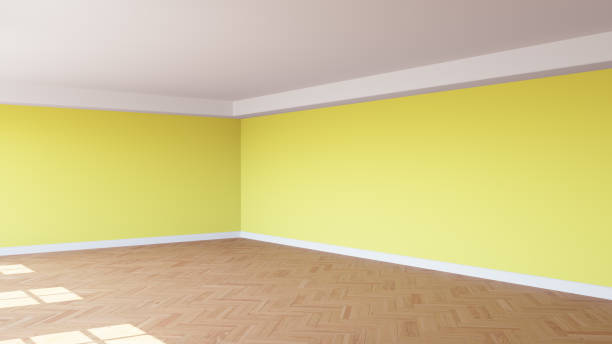 istock Corner of the Sunlit Interior with Yellow Walls, a White Ceiling and Cornice 1501984733