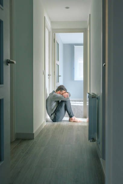 istock Man with mental disorder and suicidal thoughts crying 1502011121