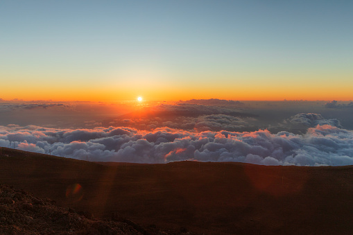Sunset above the clouds in Maui, Hawaii.