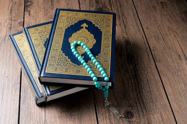 istock The Holy Al Quran with written Arabic calligraphy 1502033908