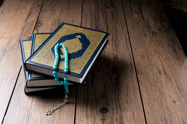 istock The Holy Al Quran with written Arabic calligraphy 1502033913