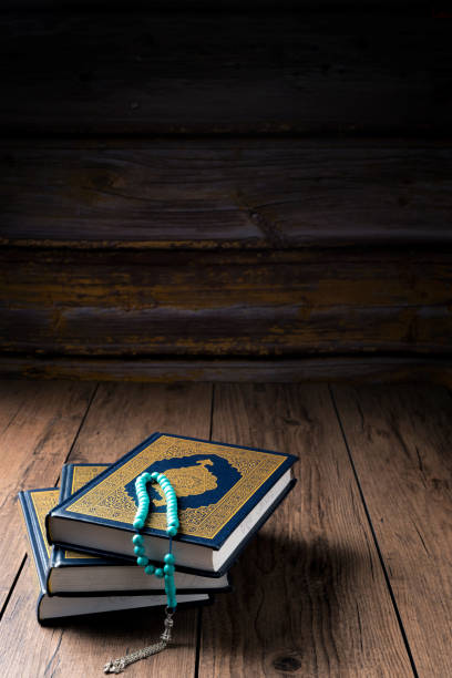 istock The Holy Al Quran with written Arabic calligraphy 1502033917