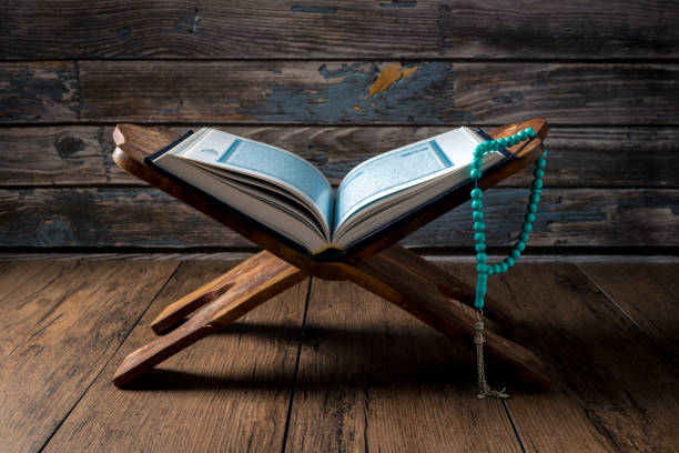 istock Islamic concept - The Holy Al Quran with written Arabic calligraphy 1502035689