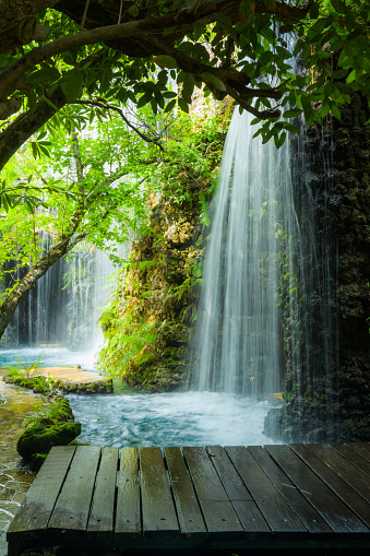 Waterfall and small bridge in Chiang Mai province, Thailand.