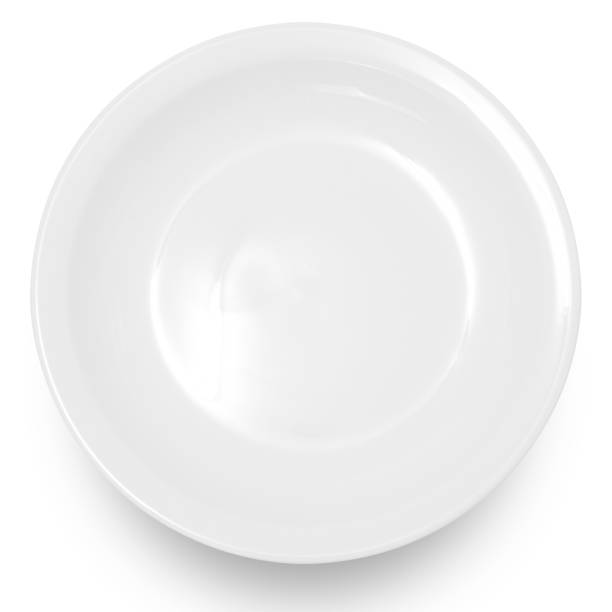 istock White circle ceramics plate isolated on white background. 1502124452