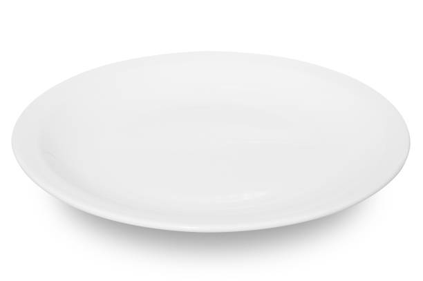 istock White circle ceramics plate isolated on white background. 1502124459