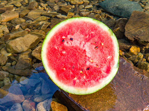 stream, outdoors, cut watermelon