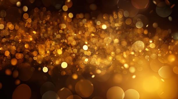 istock Gold glitters background. shimmering blur spot lights Bokeh Shiny gold light background texture. 1502126671