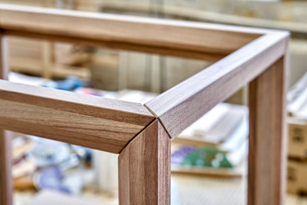 istock Wooden frame of bedside table made of solid walnut. Joinery angular joint of planks on dowels 1502126705