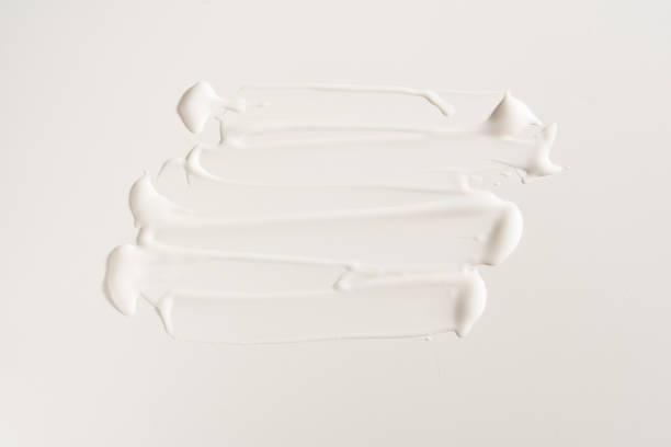 istock A white cosmetic smear on an isolated white background. Sample for advertising and packaging. The texture of a white face cream. Cosmetic skin care product with copy space. High quality photo 1502127532
