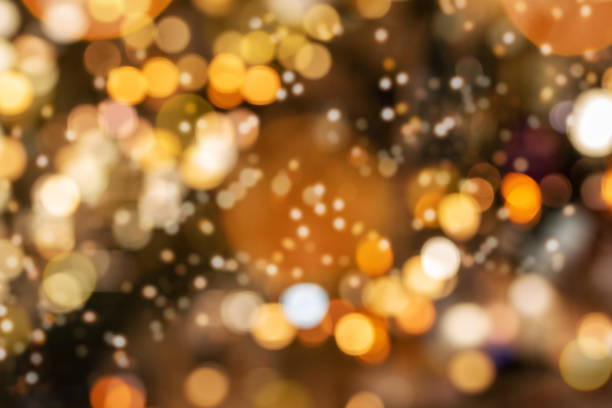 Gold shiny sparkling glittering background for use as background template on Christmas designs, cards, flyers, advertising, banners, brochures, posters, digital presentations, websites, slideshows.