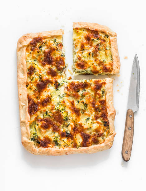istock Potato, ham, broccoli, mozzarella pie on a light background, top view 1502134707