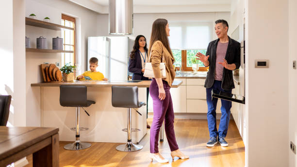 istock Woman checking kitchen at real estate showing 1502135401