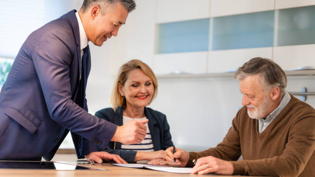 istock Senior couple singing leasing agreement 1502135695
