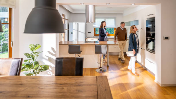 istock Senior couple checking kitchen at real estate showing 1502135738