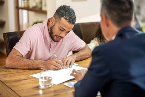 istock Man with daughter signing leasing agreement 1502135746