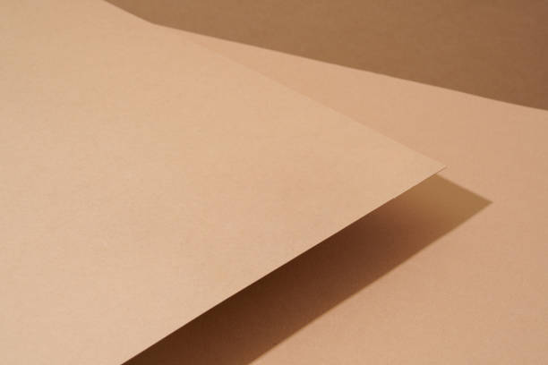 istock The colorful background from brown paper with shadow. Abstract geometric 1502138897