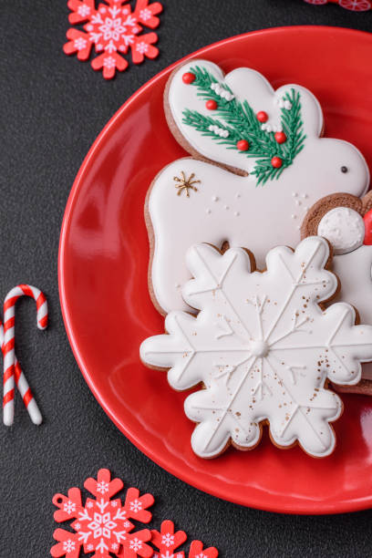 istock Beautiful bright colorful homemade gingerbread cookies on a ceramic plate 1502139154