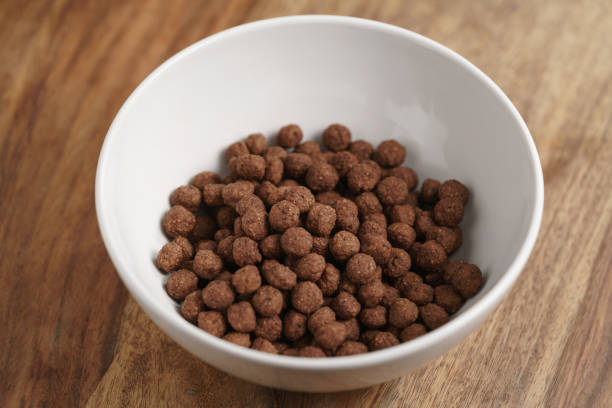 istock chocolate cereal balls in white bowl for breakfast on wooden table 1502145141