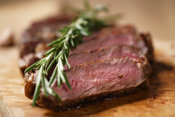 istock sliced medium rib eye steak with rosemary branch 1502152216
