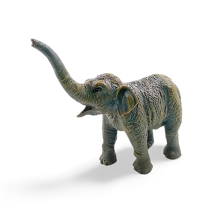 Miniature baby elephant toy isolated on white