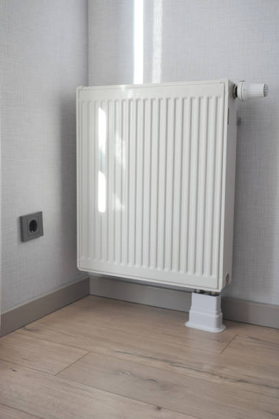 istock heating radiator under window in the room 1502162829