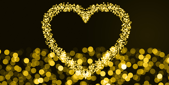 Gold heart shape bokeh and bokeh circles abtract, black background and copy space. Background for cards, covers, envelopes, web banners