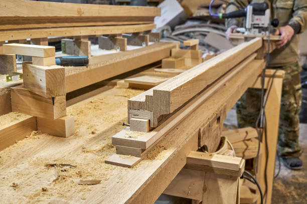 istock Carpenter milling wooden handrail with manual milling machine 1502178982