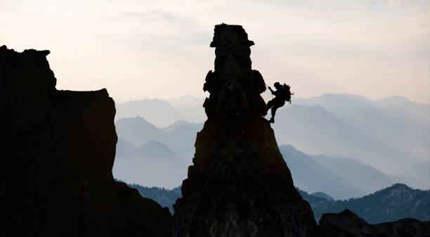 the adventure-loving rock climber struggles to reach the jagged cliffs