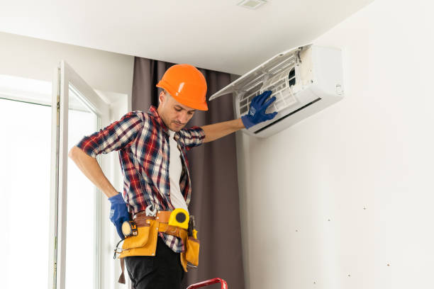 istock Professional technician maintaining modern air conditioner indoors 1502189264