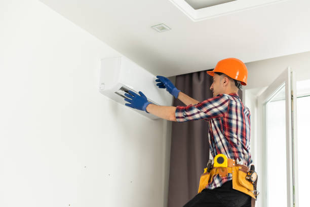 istock Professional technician maintaining modern air conditioner indoors 1502189855