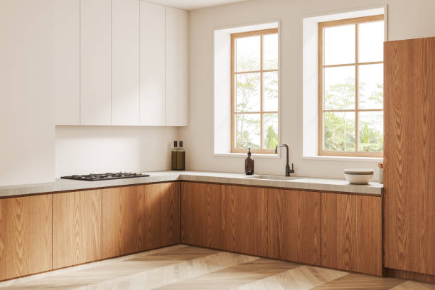 istock Modern white kitchen corner with white and wooden cabinets 1502190419