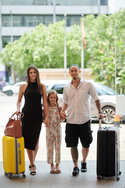 istock Family Entering Fancy Hotel 1502190503
