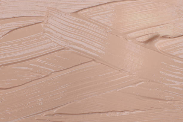 istock Beige cosmetic foundation cream background, texture 1502200153