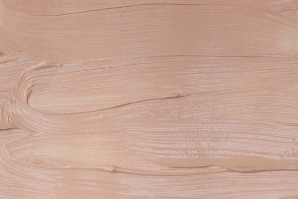 istock Beige cosmetic foundation cream background, texture 1502200160