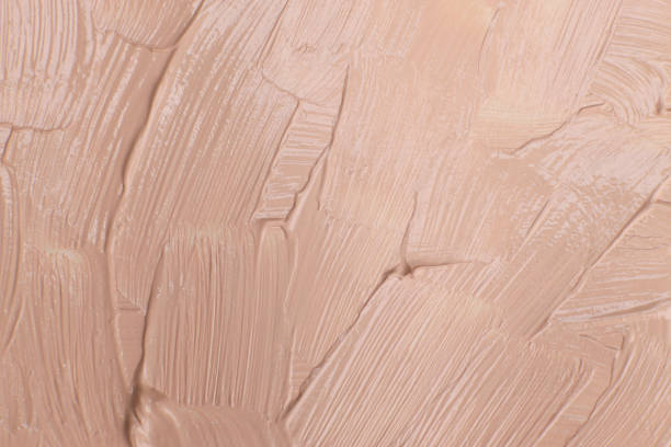 istock Beige cosmetic foundation cream background, texture 1502200161