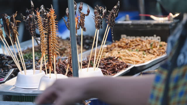 Thai Exotic StreetFood fried insects , friedscorpian ,Grasshopper ,fired caterpillar in yaowarat Bangkok Thailand