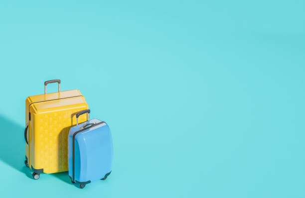 istock Yellow and blue suitcase on light blue background. Summer travel concept.,3d model and illustration. 1502202912