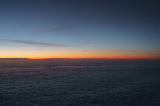 istock clouds in early morning during flight on a plane 1502218693