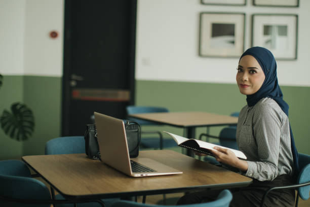 istock Creative Asian Muslim businesswoman using laptop in co-working space 1502218925
