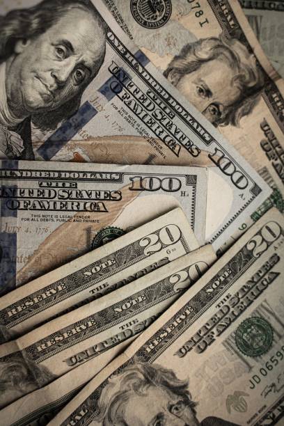 istock Arrangement of multiple hundred and twenty US Dollar bills placed together 1502219094