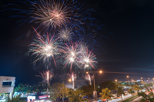 Manila, Philippines - February 03 2018: Mall of Asia in Manila, Pasay. Friday night and Fireworks in Background.
