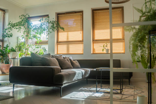 istock Low angle view cozy modern loft styled living room interior with large couch 1502220186