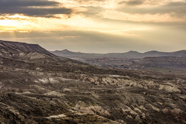 Scenic view of rock formation landscape against cloudy sky at Cappadocia,Turkey