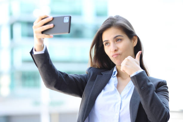 istock Executive taking selfie in the street 1502221343